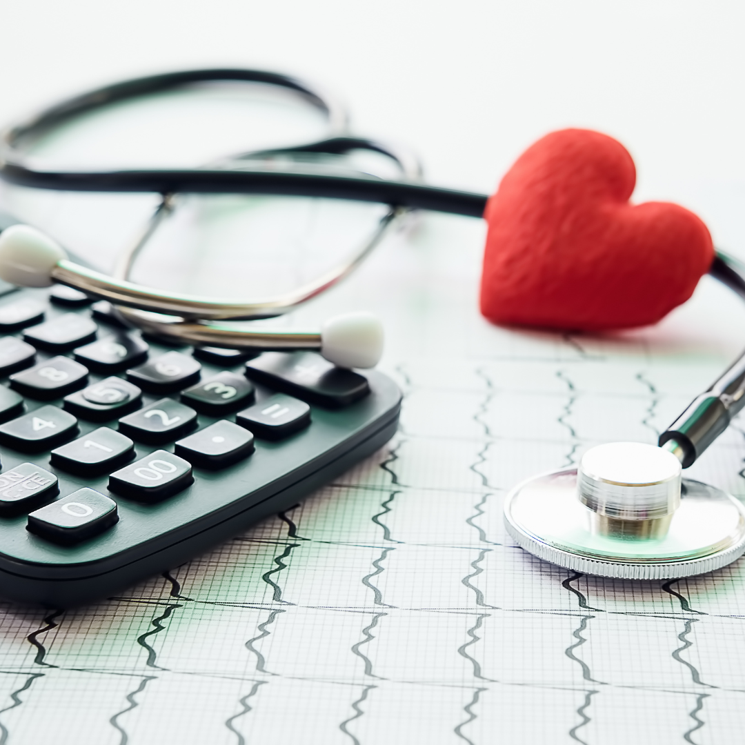 Healthcare in Madison WI – stethoscope, heart, and calculator on EKG graph